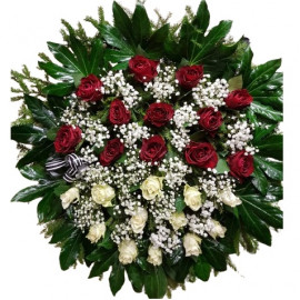 Beautiful funeral wreath with red and white roses