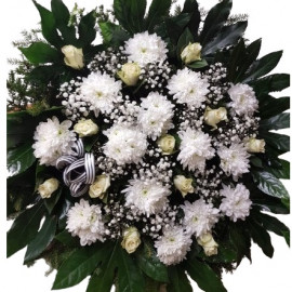 Funeral wreath with white roses and white chrysanthemums